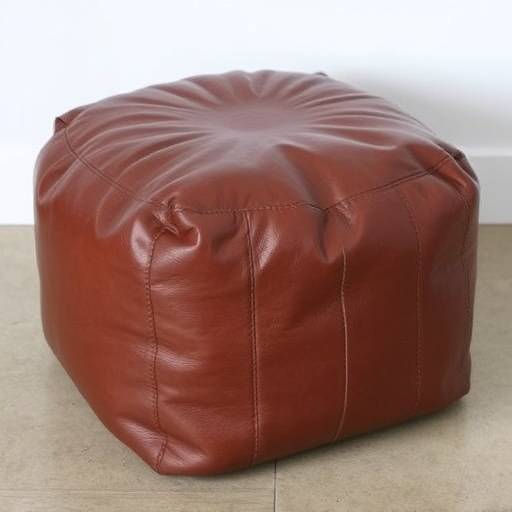 Small, square pouf made of genuine leather in a rich brown color.